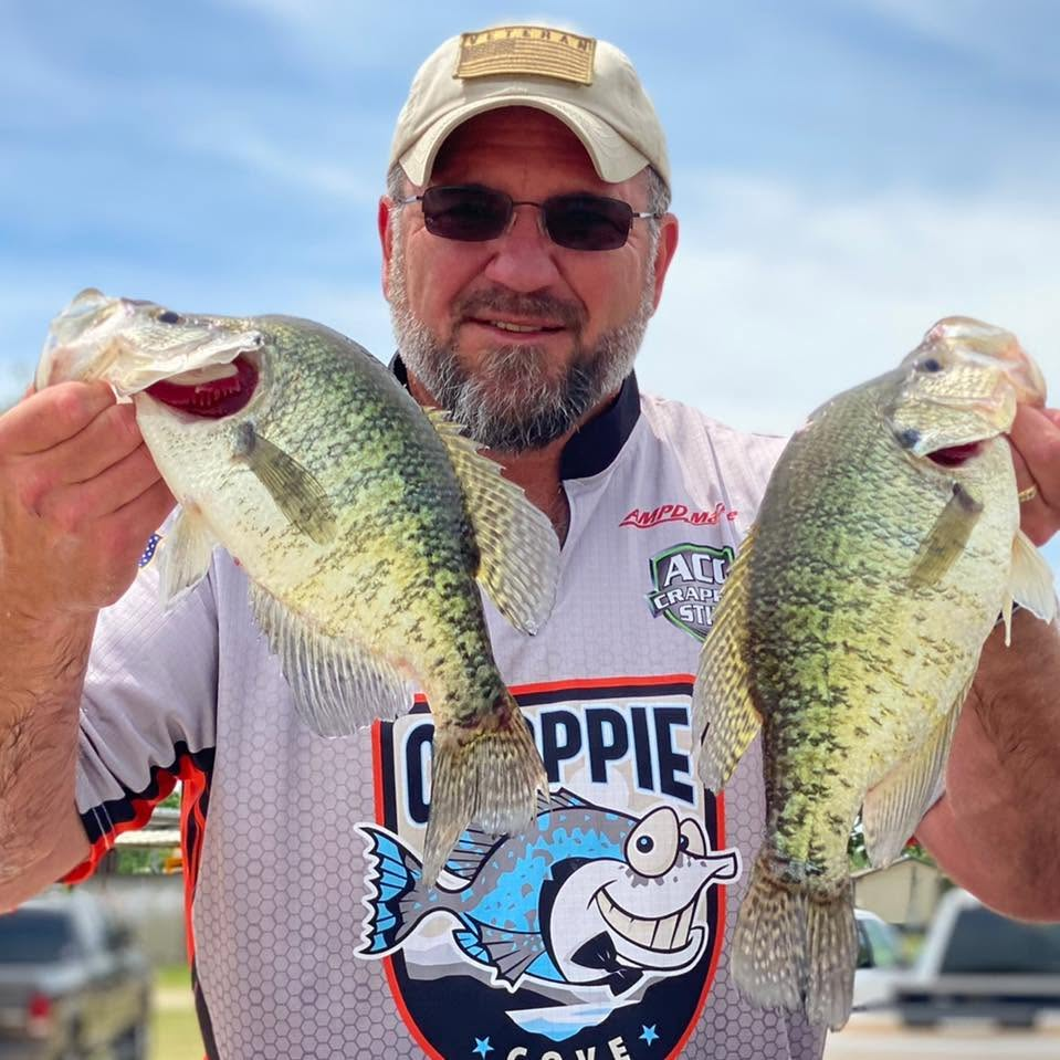 Crappie angler holding two large crappie for Kai's Custom Jigs Prostaff